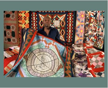 <b>Roland L. Freeman with nine of the quilts in his collection.</b>  Washington, DC 1994.